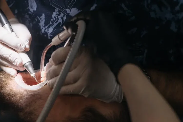 Man undergoing oral surgery procedures at dentist.