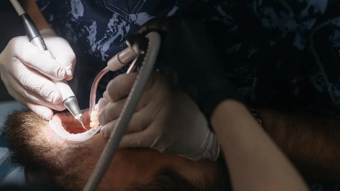 Man undergoing oral surgery procedures at dentist.