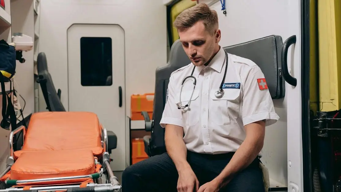 Paramedic resting in ambulance related to orthodontic emergency care.