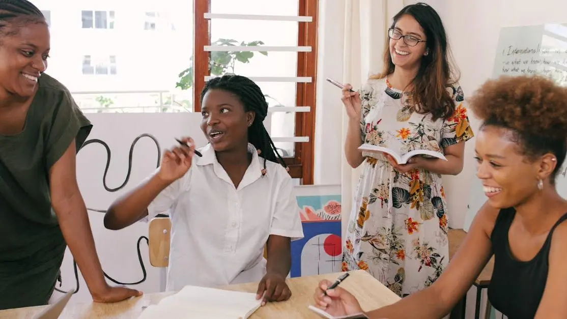 Women laughing while discussing questions about All-on-4 dental implants.