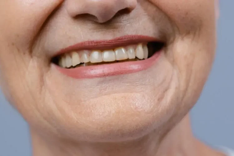 Smiling woman contemplating questions about TeethXpress dental implants.