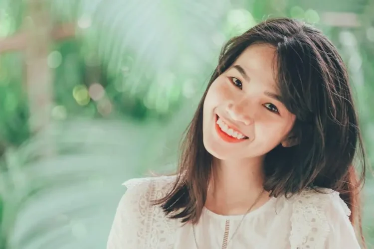 Smiling woman showcasing teeth whitening options