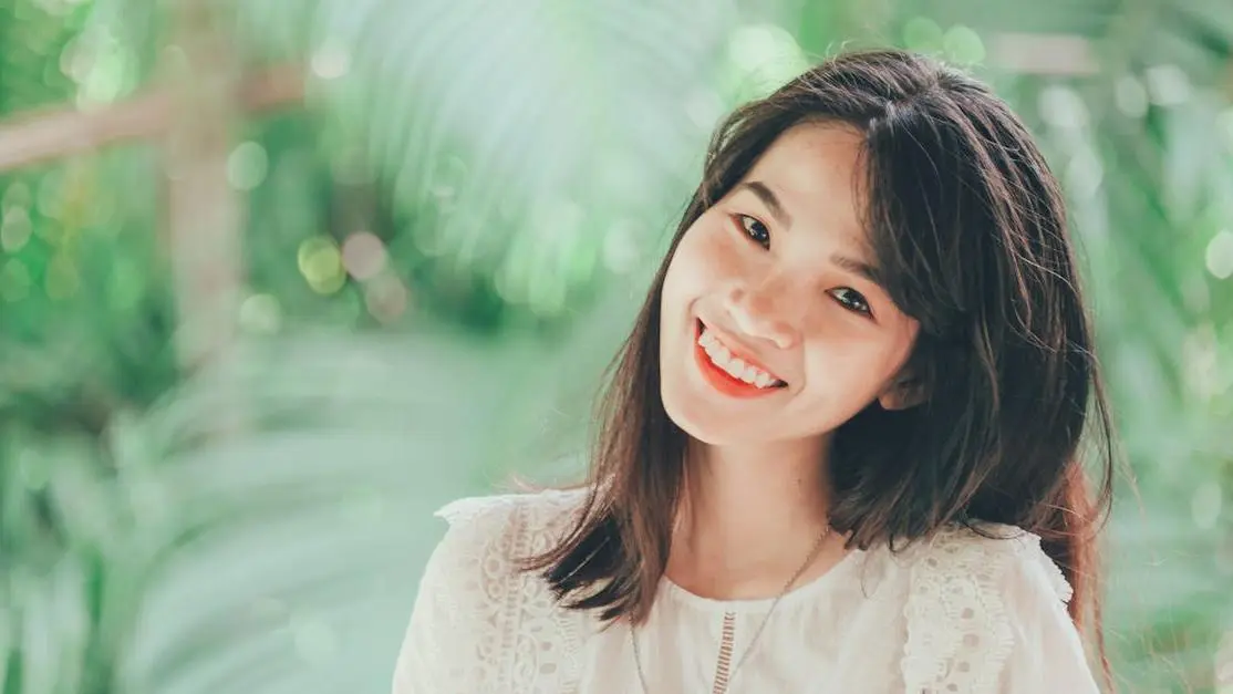 Smiling woman showcasing teeth whitening options