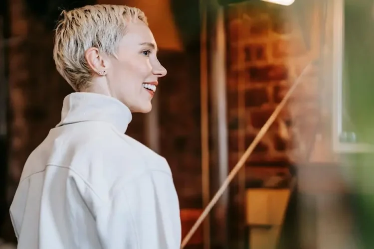 Cheerful woman smiling, showcasing teethXpress dental implants