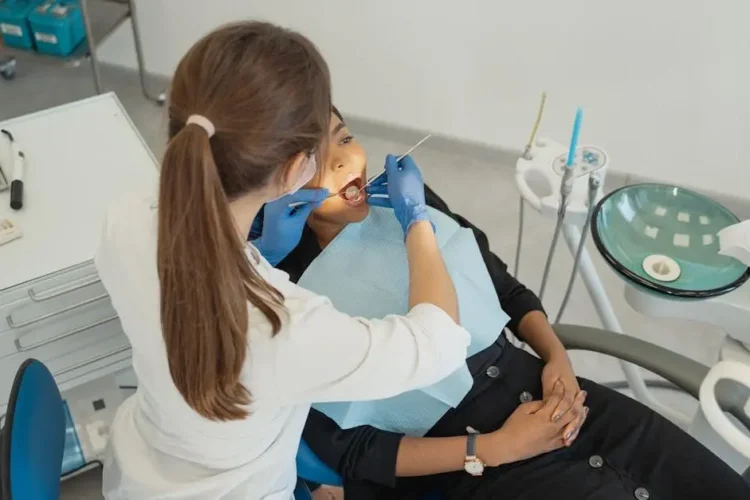 Healthcare professional performing a root canal procedure.