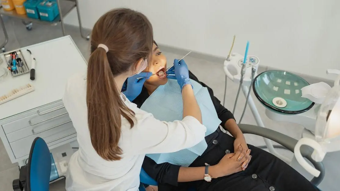 Healthcare professional performing a root canal procedure.