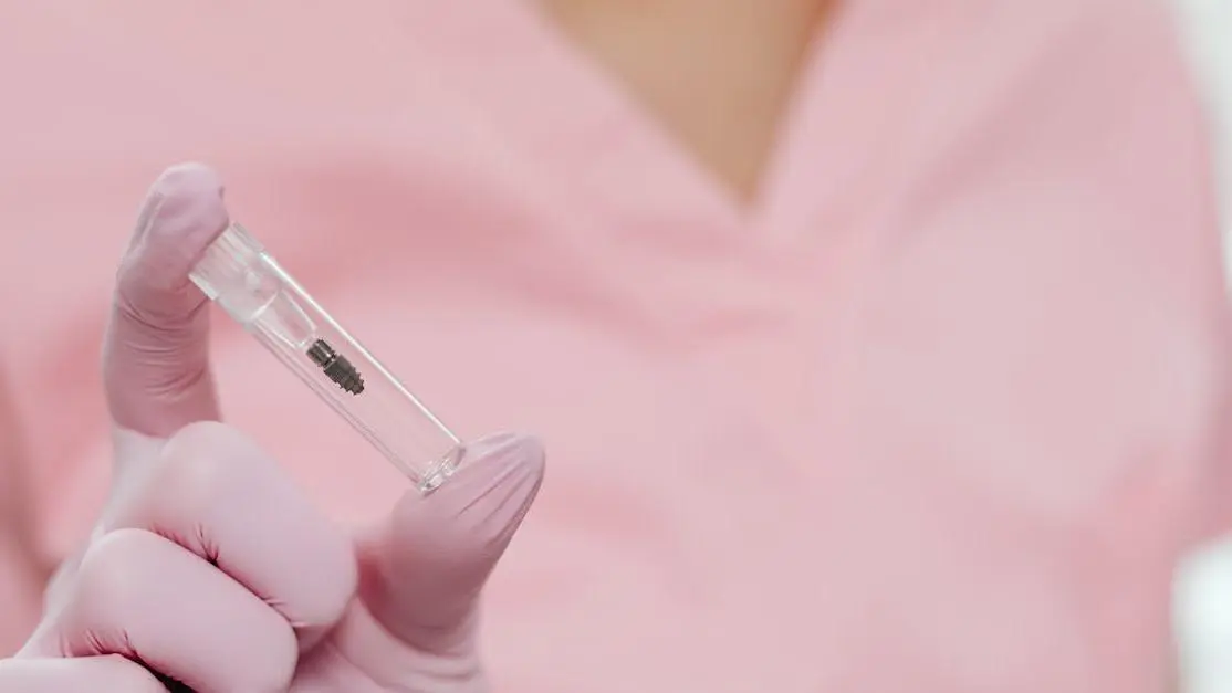 Dental implant held by a nurse in a sterile setting, showcasing what to expect from dental implant surgery.